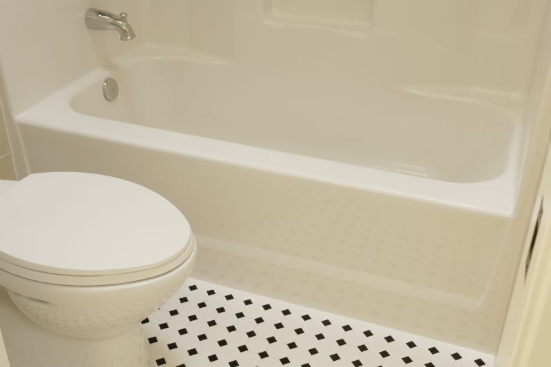 Professional preparing a bathtub surface